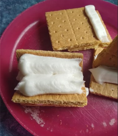 Welding in the Kitchen: Image depicts graham crackers and icing. Students practiced butt test procedures with these items.