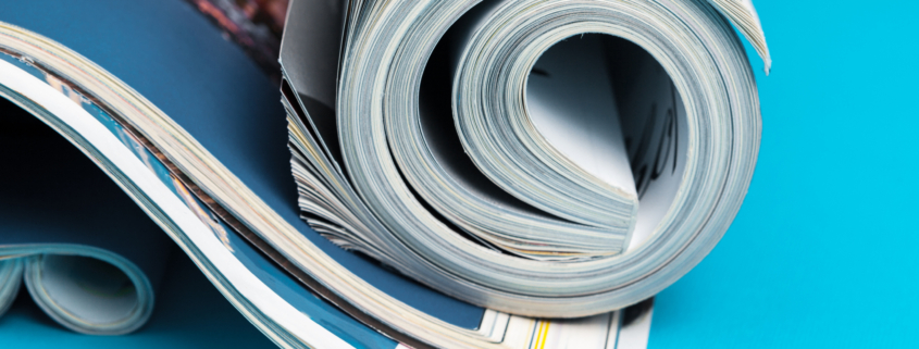 Stock photo of rolled magazines to illustrate Techniques editorial calendar